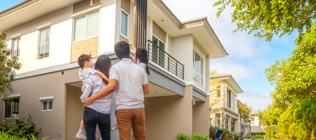 back portrait of family buying a home